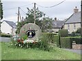 Millstone and sign, Bowsden Hall Farm