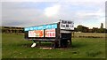 Advertising trailer in a field alongside Leeds Road, Heckmondwike