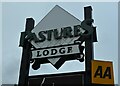 Sign for the Pastures Lodge public house