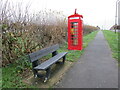 Bench and former telephone kiosk