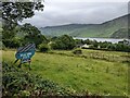 A sign for Wild Wool Barn above Ennerdale Water