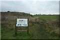 Sign beside the railway path