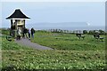 Clifftop path and shelter, with distant view of the Isle of Wight