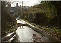 SX7574 : Wet lane at Halshanger Cottage by Derek Harper
