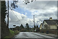 Land Rover Experience sign and houses on the east side of Awliscombe, on the A373