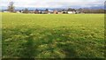 View across field of Cotehill Farm from footpath at bend in road