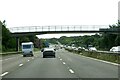 The M27 runs under a footbridge