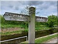 Sign along Huddersfield Broad Canal off Leeds Road