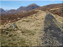 NH1405 : The old A87 and a milestone in Glen Loyne by wrobison
