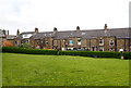 A green at the rear of Stafford Parade, Dryclough Lane and Huddersfield Road, Halifax