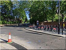 TQ2479 : Hire bikes in docks on Addison Road by Rob Purvis