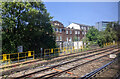 Buildings and rails on the approach to Woking station from the west