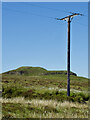 NG3630 : Electricity transmission pole with the more interesting Cnoc nan Speireag behind by Mick Garratt