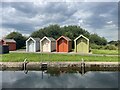 Coloured huts at the canal edge