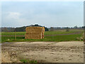 Straw bales by hardstanding, Boarded Barns Road