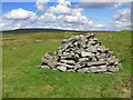 NY7535 : Cairn by an old mine shaft on Bellbeaver Rigg by Mike Quinn