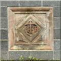 Carved sandstone plaque