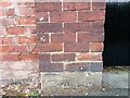 Benchmark cut into roadside wall, Ripon