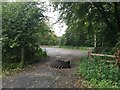 Tractor tyre blocking the entrance to a gravelled area