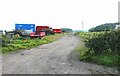 Farm vehicles parked by Auld Clay Road