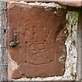 NY6323 : Bolton, All Saints Church: The Norman north doorway, graffiti on one of the stones by Michael Garlick