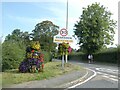 Flowers by Quarndon village sign