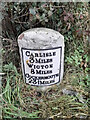 NY3653 : Old Milestone by the A595 by Barbara Todd