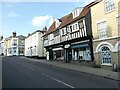 Half-timbering above modern shop windows, Saffron Walden