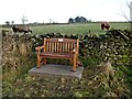 NY8365 : Memorial bench near Chesterfield Farm by Oliver Dixon