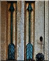 NY4348 : Wreay, St. Mary's Church: Arrows, symbols of death, set within the south door panel by Michael Garlick