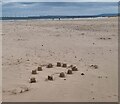 NZ5229 : Abandoned sand castles by Oliver Dixon