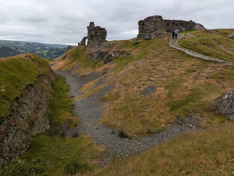 Earthworks by the ruins of Castell Dinas... © TCExplorer cc-by-sa/2.0 ...