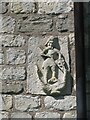 Old carving on the exterior of St Mary Magdalene church