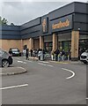 Queue outside Farmfoods in Discovery Park, Newport