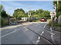 Red car at Crundale level crossing