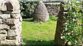 Stone sculpture in stone wall compound