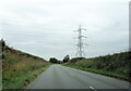 Overhead power lines cross Watling Street, the B5061