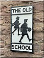 Sign on the wall of The Old School, Llangorse