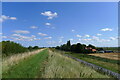 The Hereward Way on the bank of the New Bedford River passing Four Balls Farm