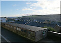 Garages on Langton Street seen from a petrol station on Burnley Road (A646), Sowerby Bridge