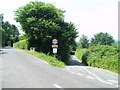 The narrow road running down to the ford