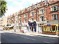 TQ2576 : Shops and restaurants in New Kings Road, in Fulham by David Hawgood