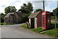 Bus stop and telephone box in the village of Clifford