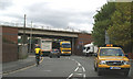 The barge BARMERE on Waterloo Road, passing beneath the Widnes-Runcorn Bridge approach Road