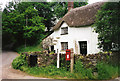 Merton: cottage by Merton Mill Cross