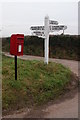 Signpost and postbox at Chawleigh Week Cross