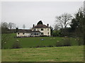 House with sheep grazing.