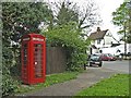 Red Telephone Box at Mill Green, Hertfordshire,  with the Green Man public house in the background