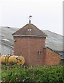 Building with weathervane