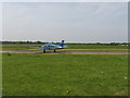 Light plane awaiting take-off, Fairoaks airport